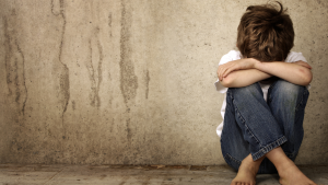 Photo of a child crying alone