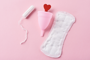 a tampon, menstrual cup and pad